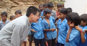 Kentaro Toyama, here with Rajasthani children, is the W. K. Kellogg Professor at the University of Michigan School of Information